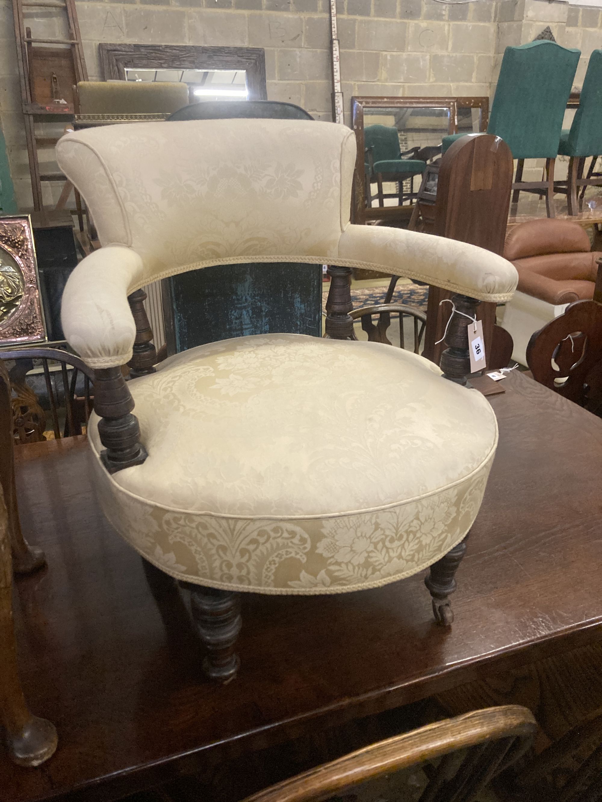 A late Victorian upholstered tub framed elbow chair, together a Queen Anne style dressing stool